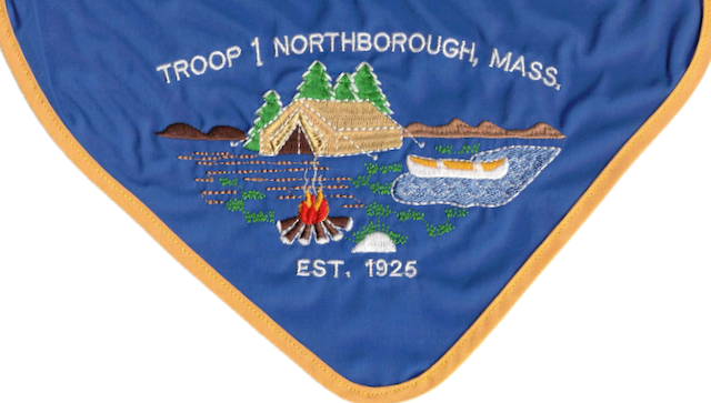 Troop 1 Northborough neckerchief — an embroidered lakeside scene with a tent, canoe, and campfire, reading “Troop 1 Northborough, Mass.” and “Est. 1925”